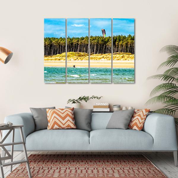 Solo Kiteboarder Over Summer Waves Canvas Wall Art in yellow, green and blue, hung on a wall