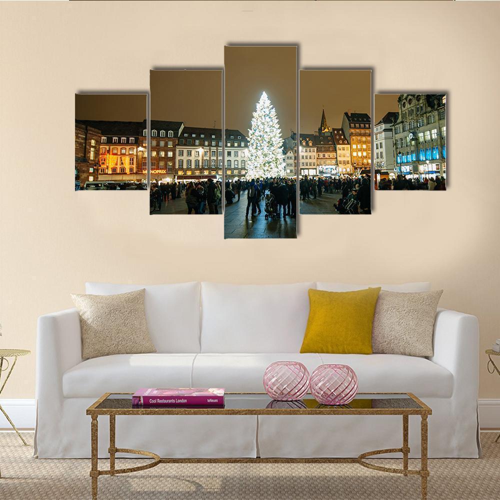 Kleber Square Christmas Night Canvas Wall Art in black, brown and yellow, 5 panel Star layout hung on a wall