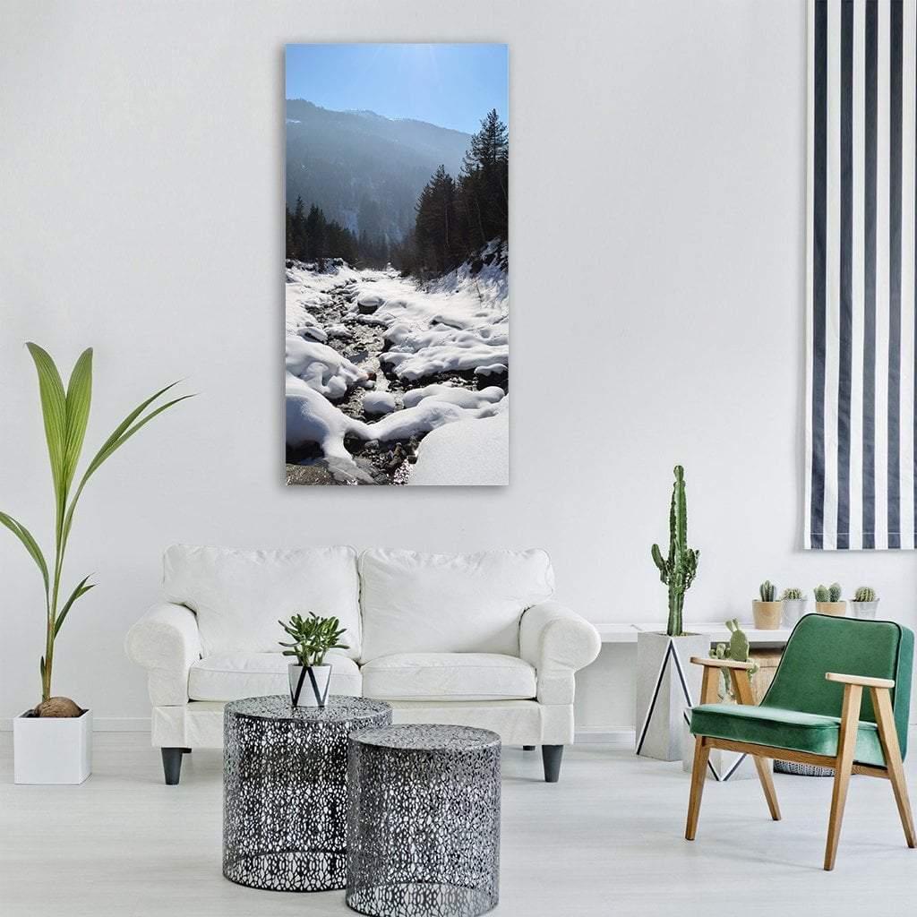 Klostertal Valley in Winter Vertical Canvas Wall Art in white, gray and blue, single vertical panel hung on a wall