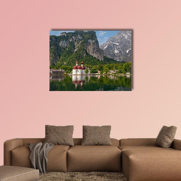 Konigssee Lake with Twin Red-domed Church Canvas Wall Art in gray, green and blue, single panel hung on a wall