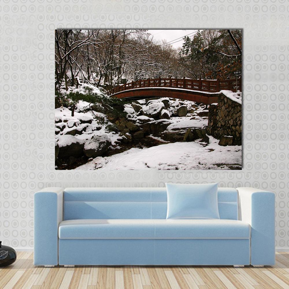 Korean Bridge in Winter Canvas Wall Art in white, gray and brown, single panel hung on a wall