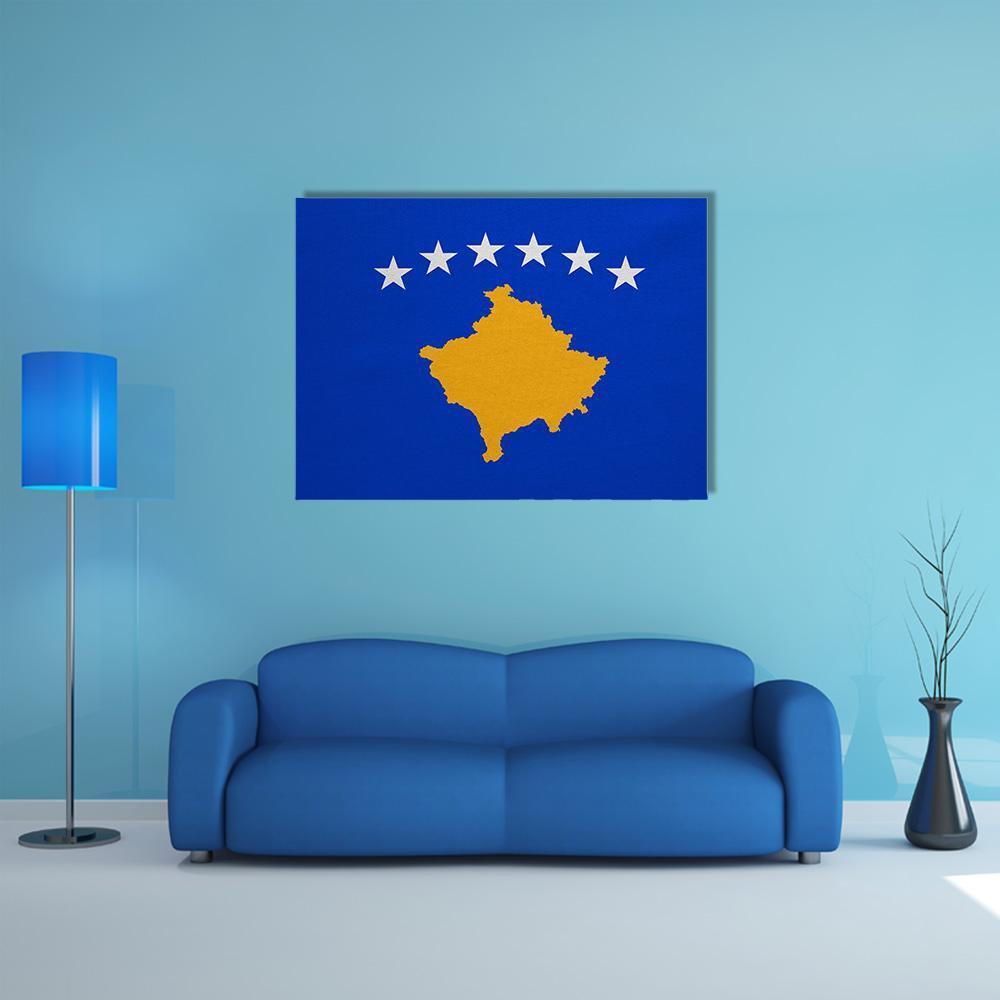 Kosovo Flag with Map Outline Canvas Wall Art in white, yellow and blue, single panel hung on a wall