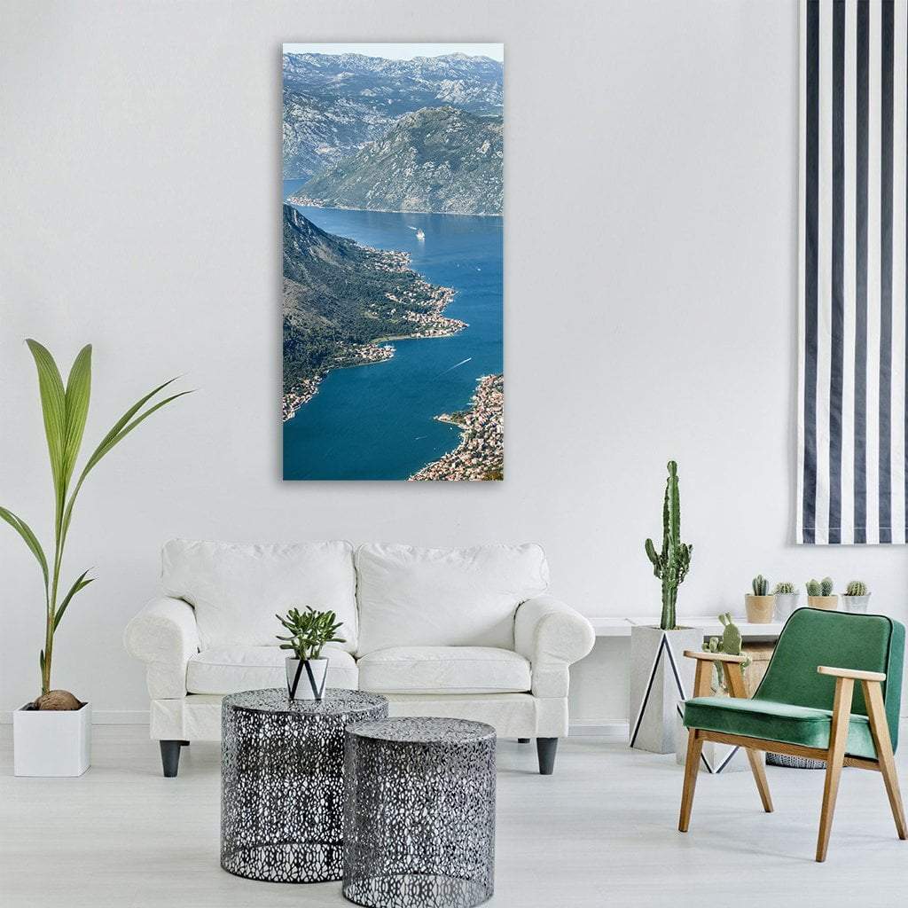 Aerial View of Kotor Bay Vertical Canvas Wall Art in gray, green and blue, single vertical panel hung on a wall