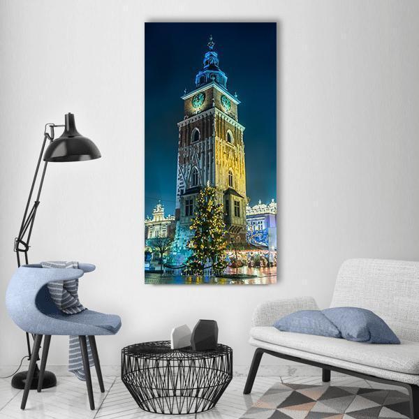 Krakow Town Hall Tower at Night Vertical Canvas Wall Art in brown, yellow and blue, single vertical panel hung on a wall