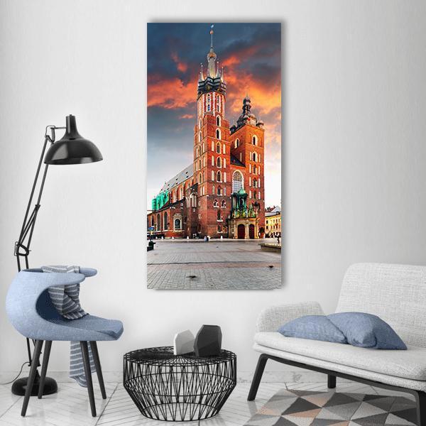 Krakow Old Town Brick Cathedral at Dusk Vertical Canvas Wall Art in brown, orange and blue, single vertical panel hung on a wall
