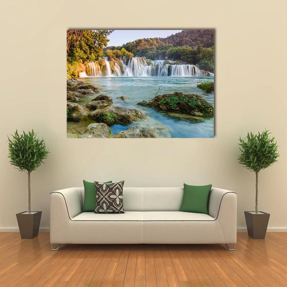 Krka River Waterfalls Canvas Wall Art in white, green and blue, single panel hung on a wall