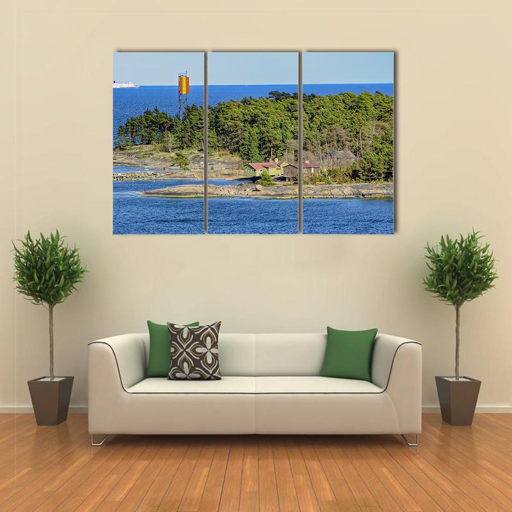 Kyto Island Lighthouse, Finland Canvas Wall Art in green and blue, 3 panel horizontal set hung on a wall