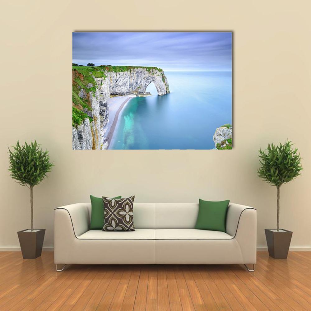 La Manneporte Natural Sea Arch Canvas Wall Art in gray, green and blue, single panel hung on a wall