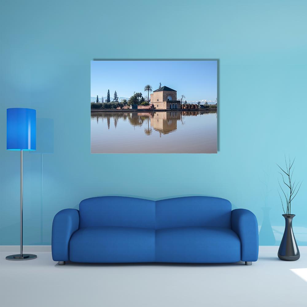 La Menara Reservoir with Palm Reflection Canvas Wall Art in beige, brown and blue, single panel hung on a wall