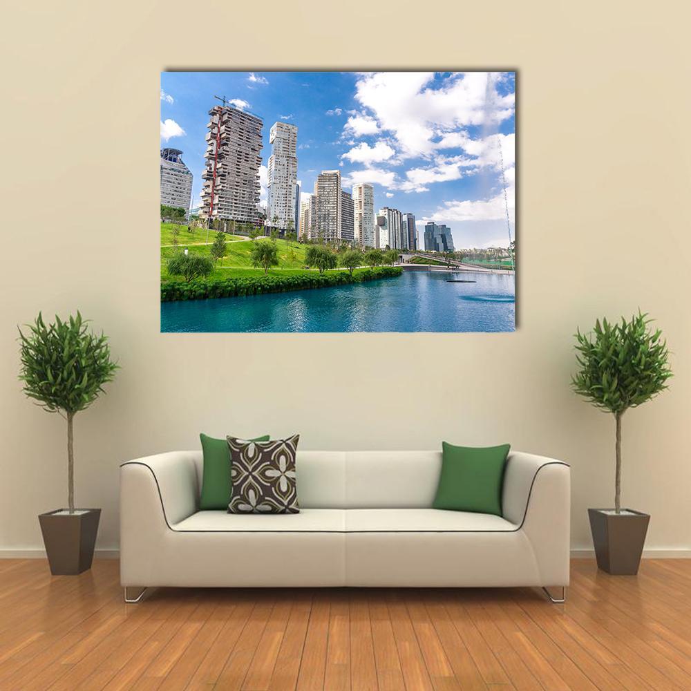 La Mexicana Park Cityscape Canvas Wall Art in white, green and blue, single panel hung on a wall
