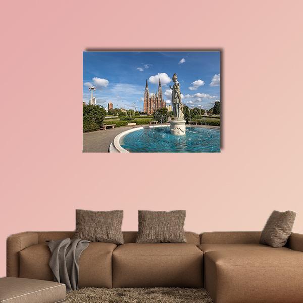 La Plata Cathedral and Park Fountain Canvas Wall Art in brown, green and blue, single panel hung on a wall
