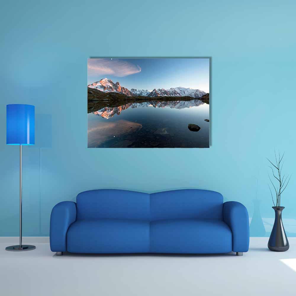 Mountain Reflection on Calm Alpine Lake Canvas Wall Art in white, gray and blue, single panel hung on a wall