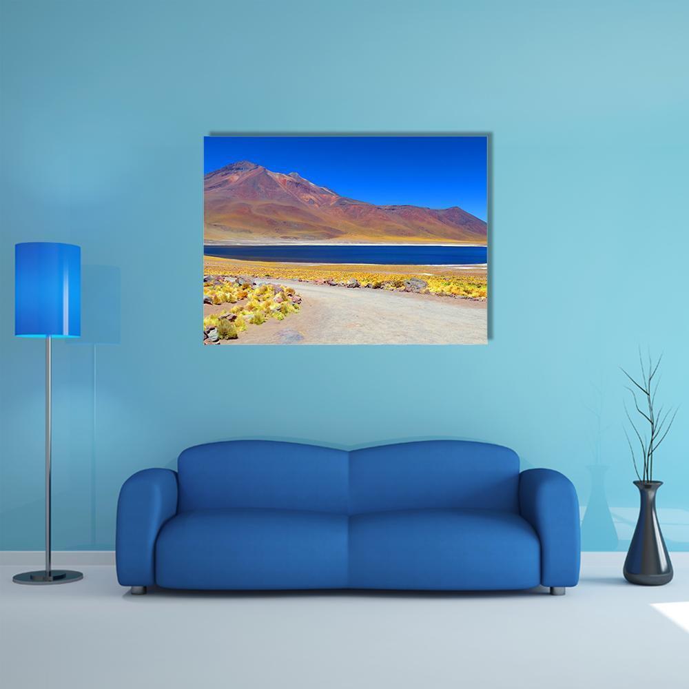 Laguna Miniques Mountain Lake Canvas Wall Art in brown, yellow and blue, single panel hung on a wall