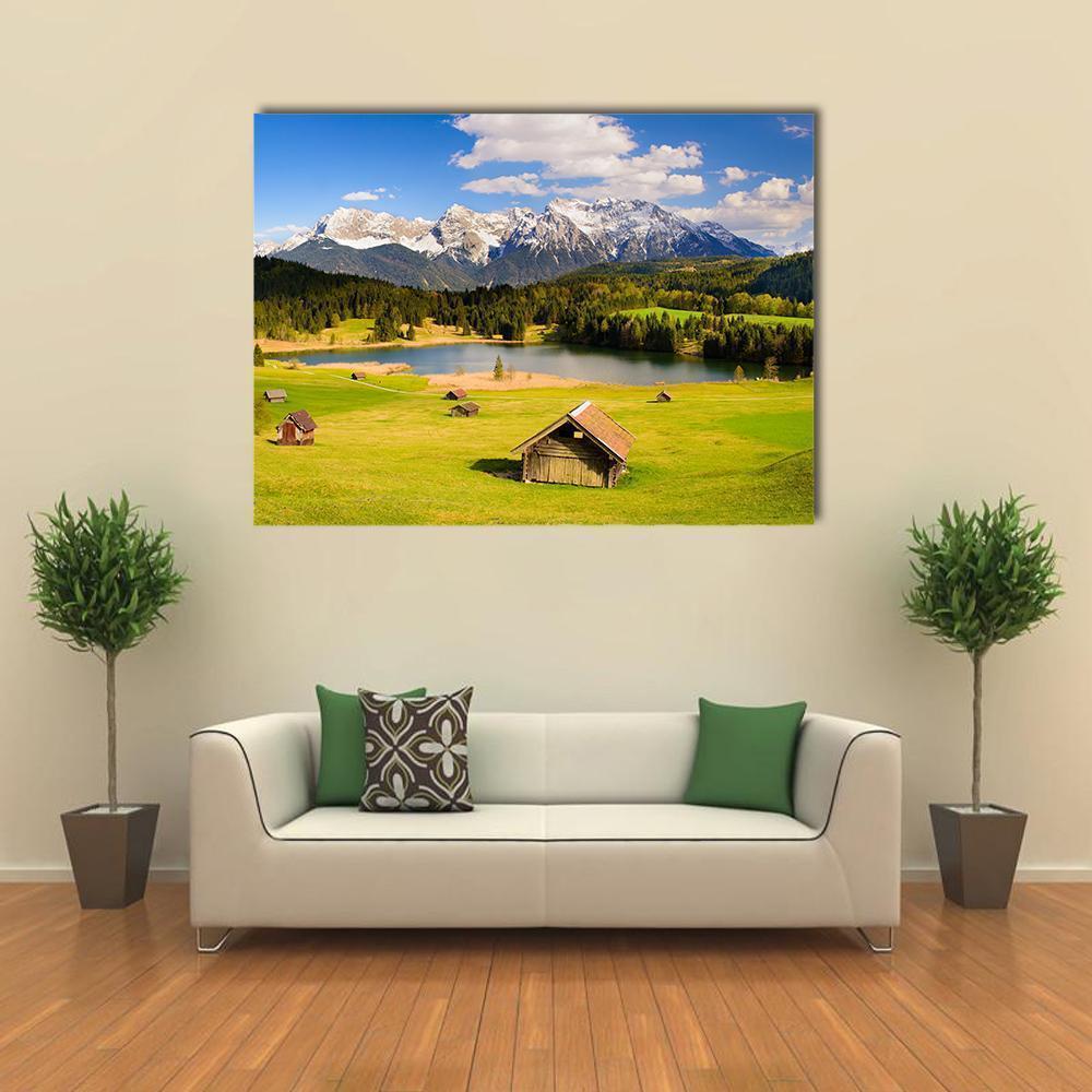 Bavarian Lake with Alpine Meadows Canvas Wall Art in white, green and blue, single panel hung on a wall