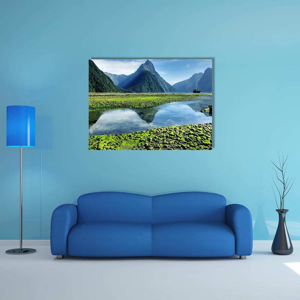Mitre Peak Reflected on Lake Canvas Wall Art in gray, green and blue, single panel hung on a wall