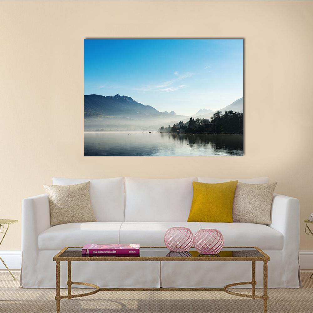 Misty Mountain Lake at Dawn Canvas Wall Art in white, gray and blue, single panel hung on a wall