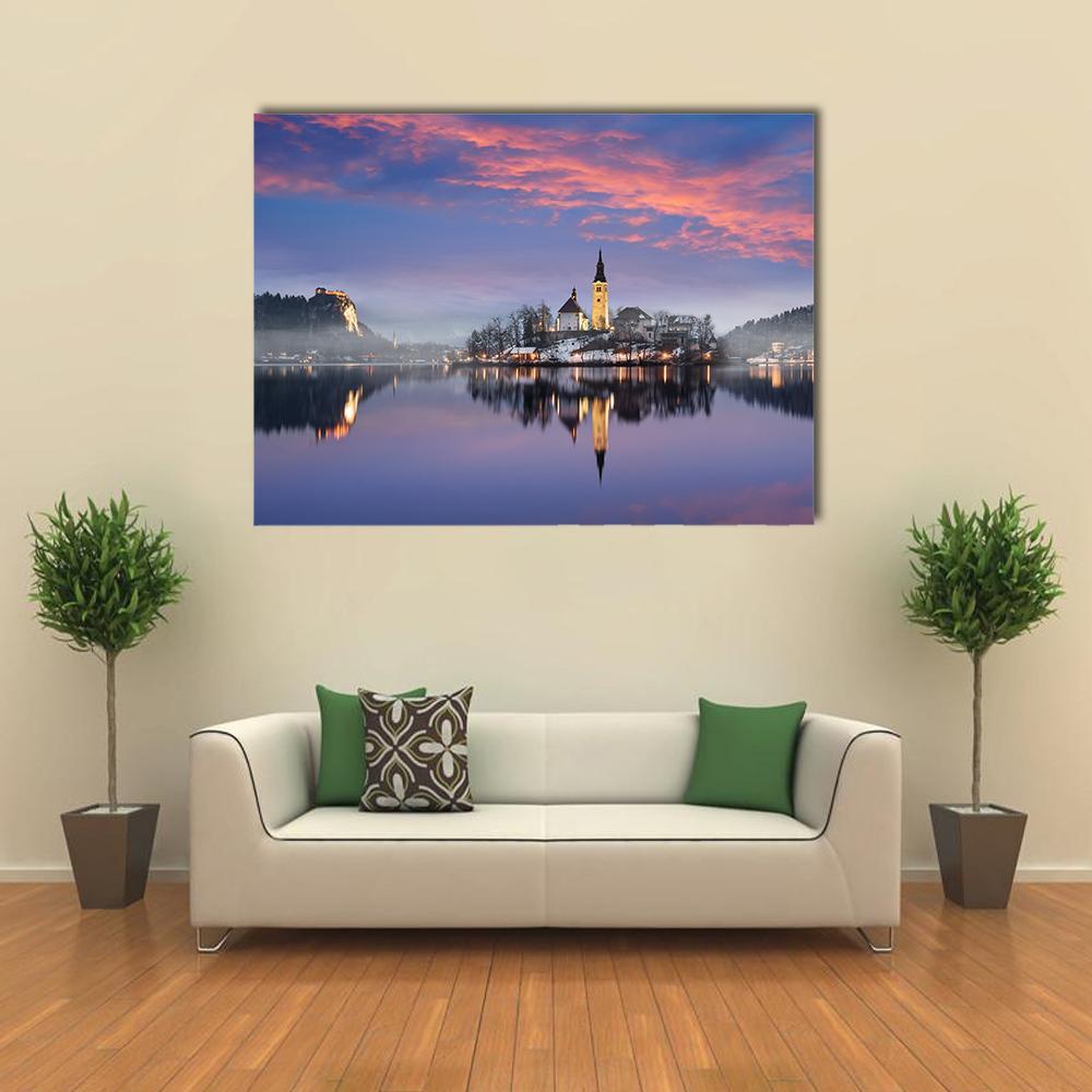 Lake Bled in Winter Canvas Wall Art in blue, purple and pink, single panel hung on a wall