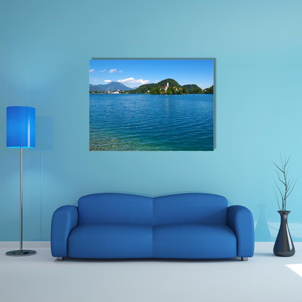 Lake Bled and Mountains Canvas Wall Art in green and blue, single panel hung on a wall