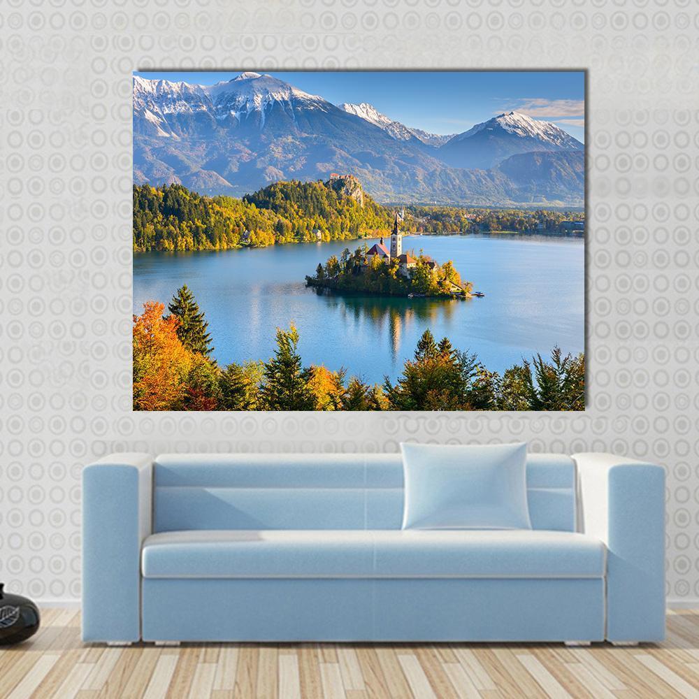 Lake Bled Slovenia Artwork Canvas Wall Art in yellow, green and blue, single panel hung on a wall