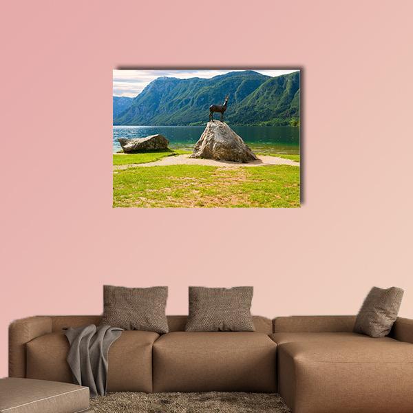 Lake Bohinj with Chamois Statue Canvas Wall Art in gray, green and blue, single panel hung on a wall