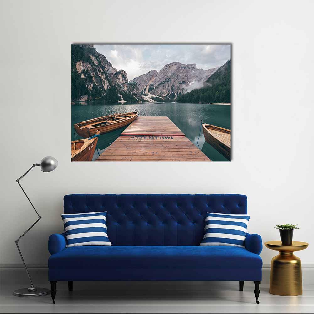 Rowing Boats on Lake Braies Canvas Wall Art in gray, brown and green, single panel hung on a wall