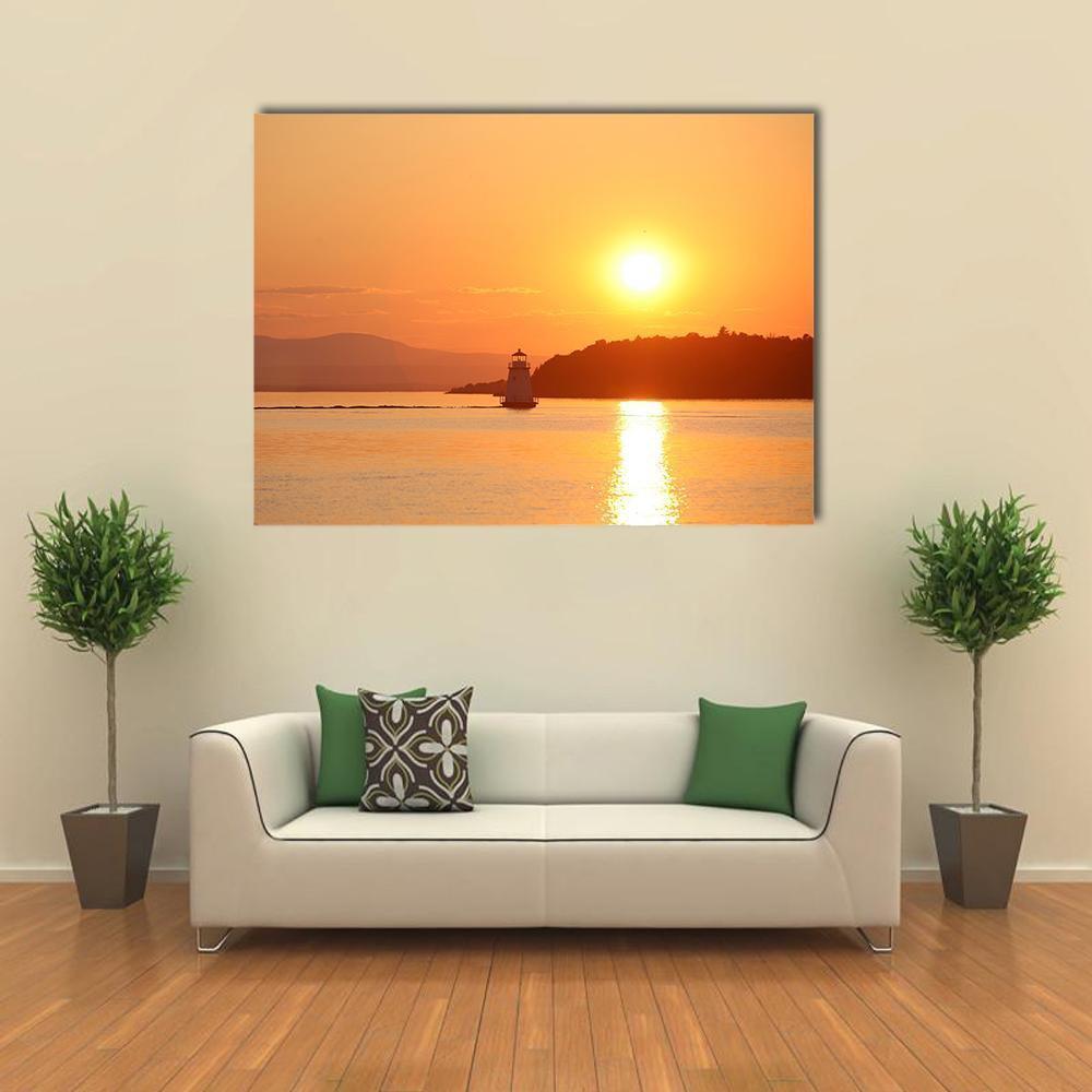 Lake Champlain Lighthouse at Sunset Canvas Wall Art in orange and yellow, single panel hung on a wall