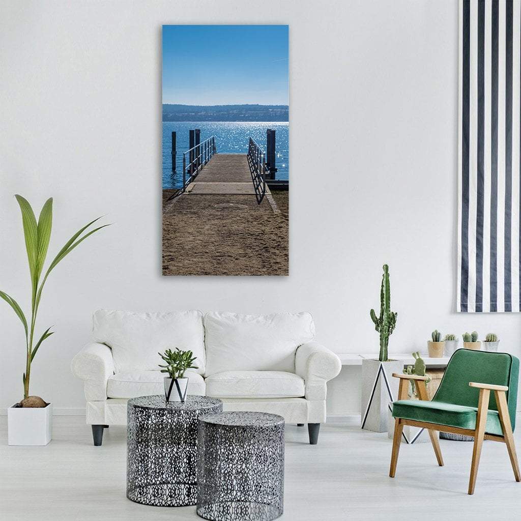 Wooden Pier at Lake Constance Vertical Canvas Wall Art in beige, brown and blue, single vertical panel hung on a wall