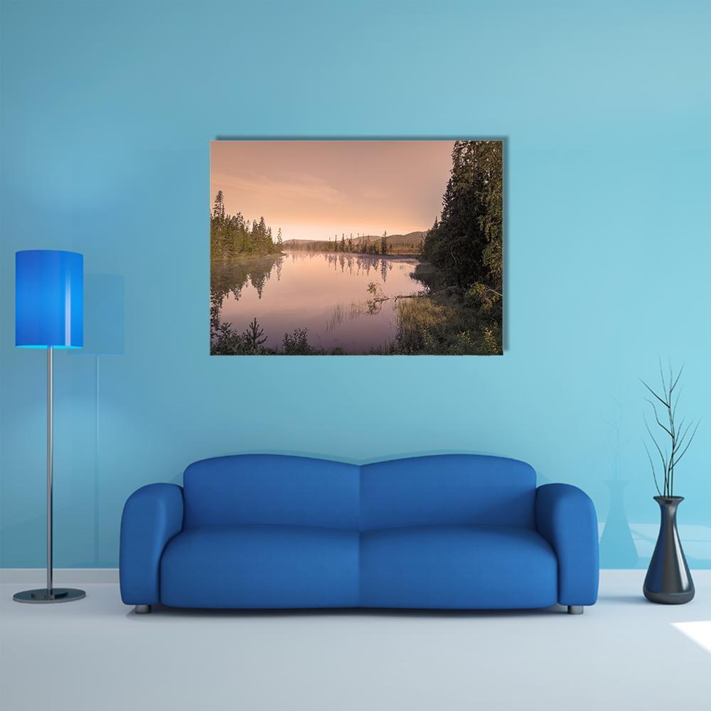 Misty Sunrise Over Lake Canvas Wall Art in brown, orange and pink, single panel hung on a wall