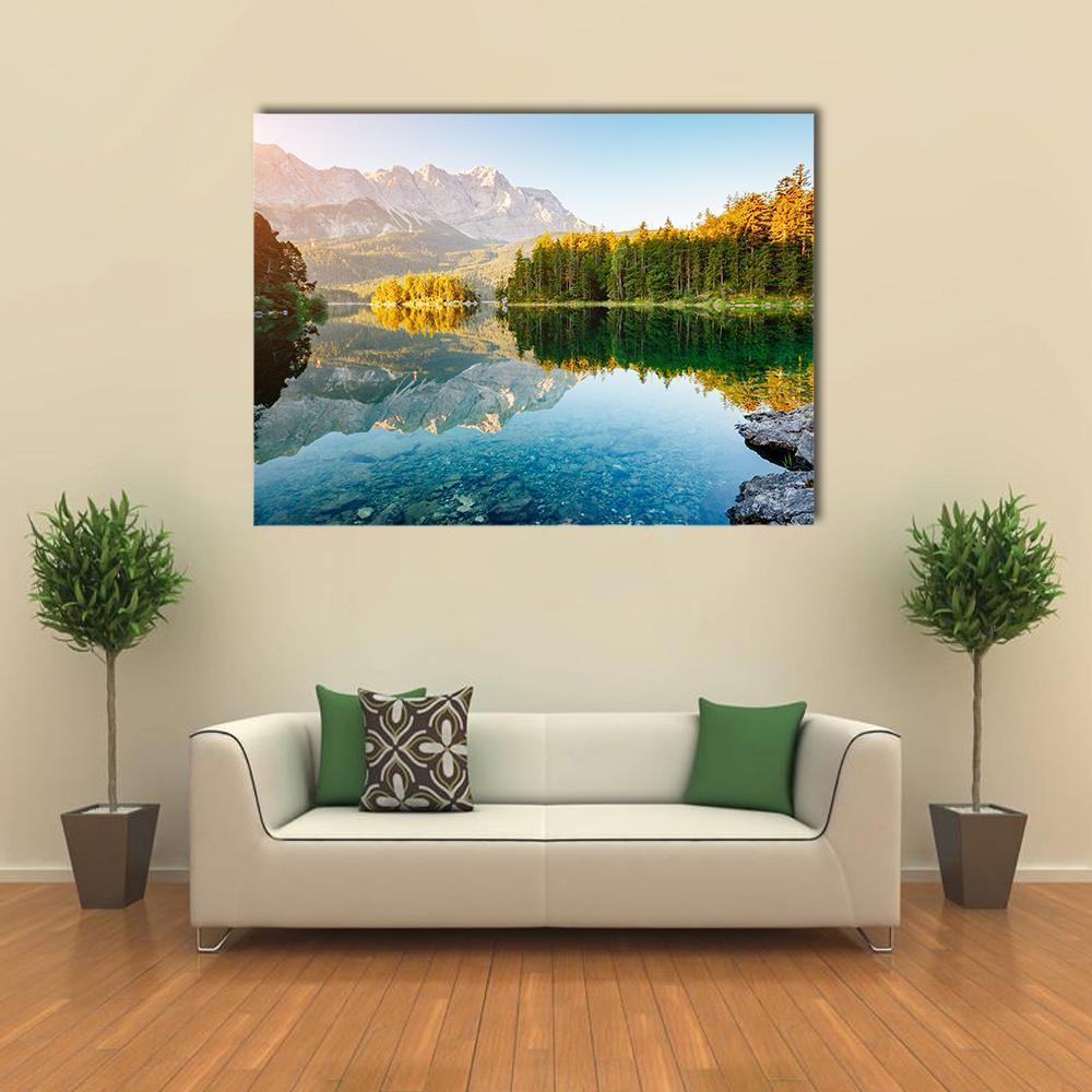 Lake Eibsee in Sunlight Canvas Wall Art in yellow, green and blue, single panel hung on a wall