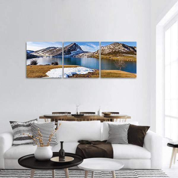 Blue Lake and Snow-dusted Peaks Panoramic Canvas Wall Art in white, brown and blue, hung on a wall