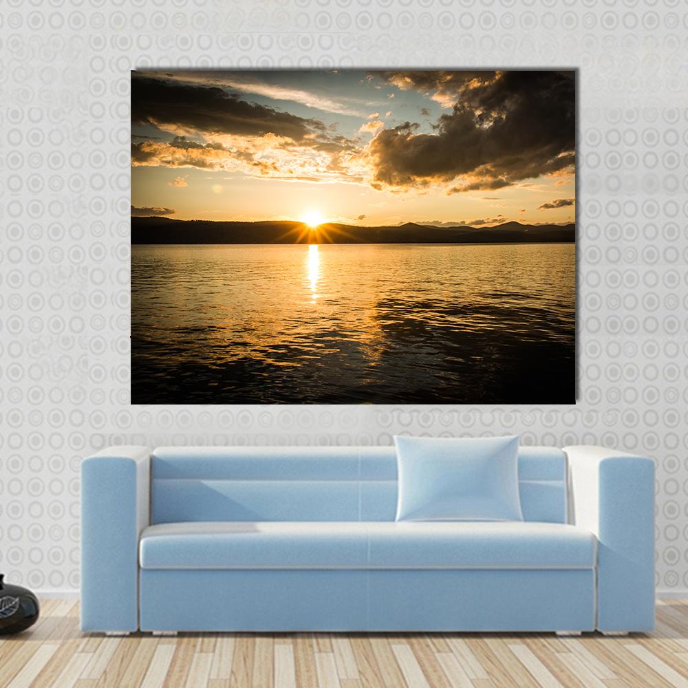 Lake George Sunset Canvas Wall Art in black, orange and yellow, single panel hung on a wall