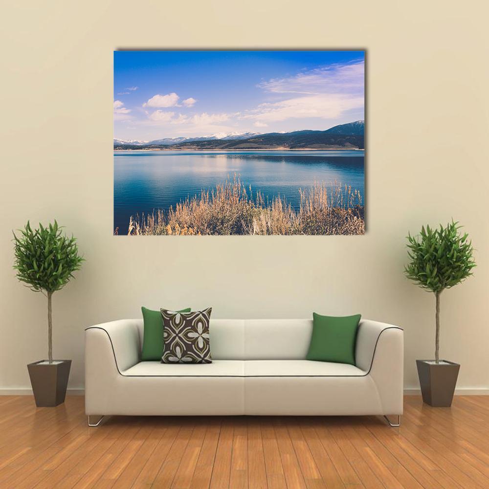Lake Granby with Snow-capped Mountains Canvas Wall Art in white, beige and blue, single panel hung on a wall