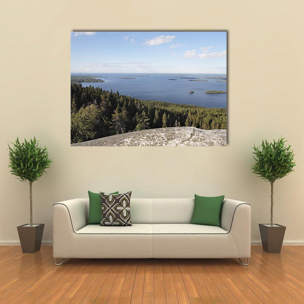 Rocky Island on a Finnish Lake Canvas Wall Art in gray, green and blue, single panel hung on a wall