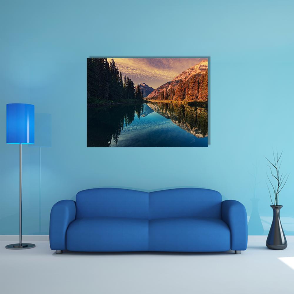 Grand Teton Lake Reflection Canvas Wall Art in brown, orange and blue, single panel hung on a wall