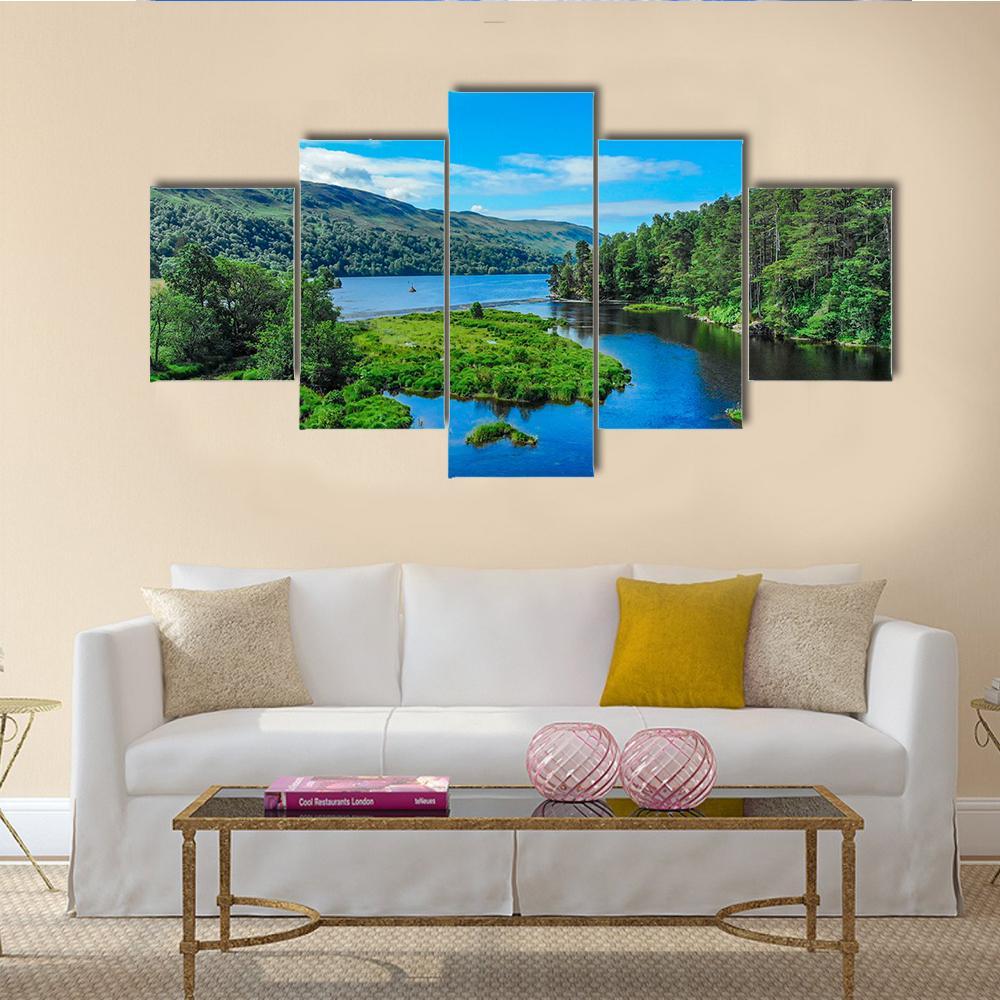 Island on a Mountain Lake Canvas Wall Art in green and blue, 5 panel Star layout hung on a wall