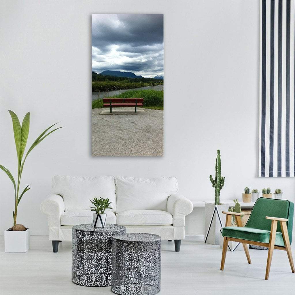 Red Bench by Mountain Lake Vertical Canvas Wall Art in gray, green and blue, single vertical panel hung on a wall