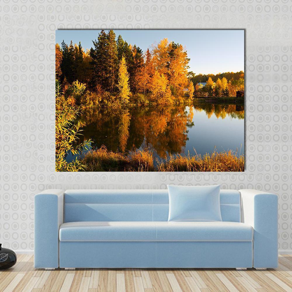 Lake in Sunset Rays Canvas Wall Art in orange, yellow and blue, single panel hung on a wall
