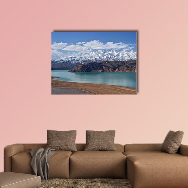 Turquoise Lake with Snow-capped Mountains, Uzbekistan Canvas Wall Art in white, brown and blue, single panel hung on a wall