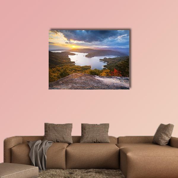 Lake Jocassee Sunset Over Mountains Canvas Wall Art in brown, orange and blue, single panel hung on a wall
