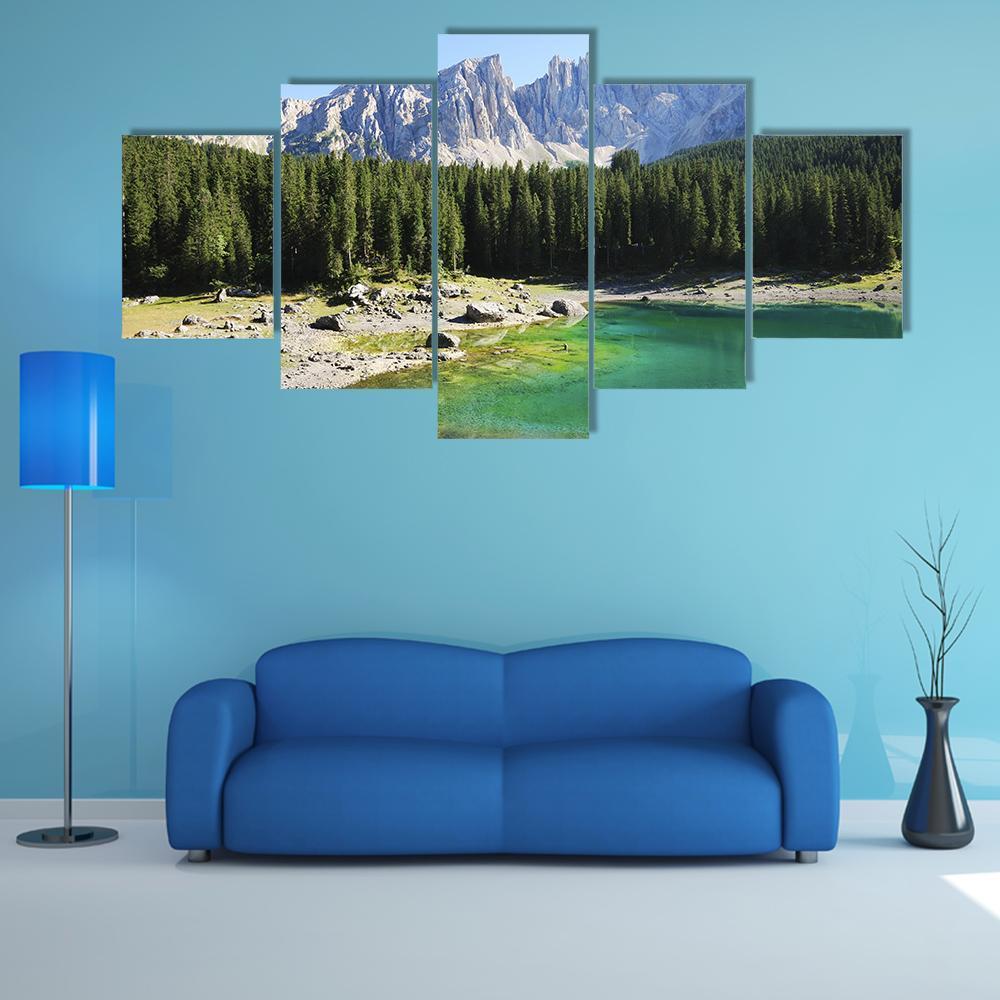 Clear Mountain Lake with Evergreen Forest Canvas Wall Art in gray, green and blue, 5 panel Star layout hung on a wall