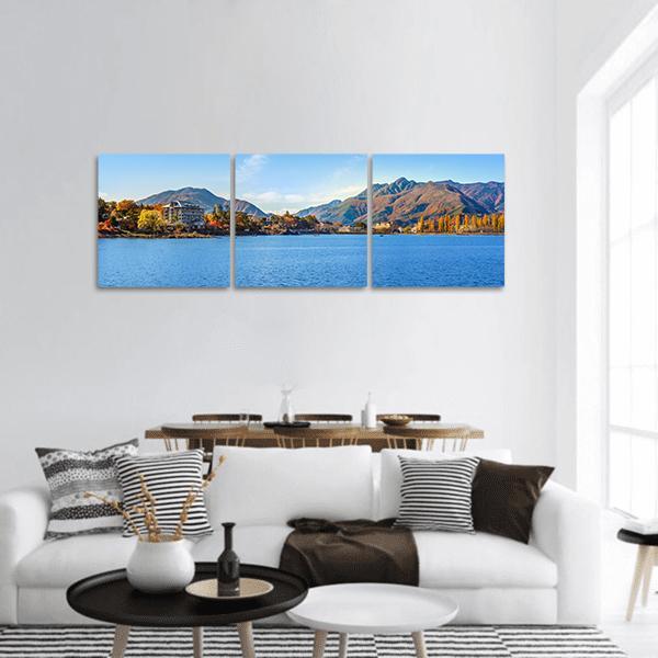 Lake Kawaguchi Autumn Lakeside View Panoramic Canvas Wall Art in brown, orange and blue, hung on a wall
