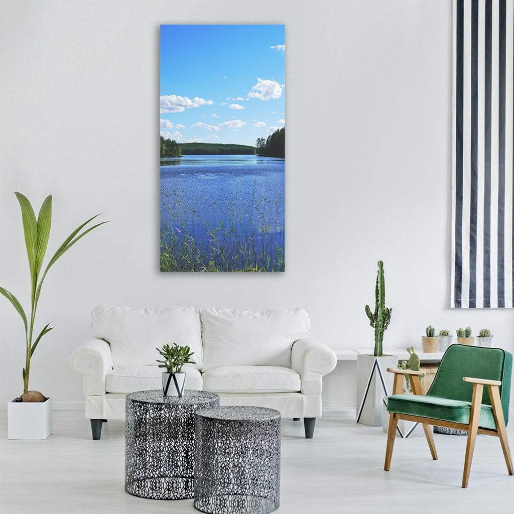 Lake Landscape in Finland Vertical Canvas Wall Art in white, green and blue, single vertical panel hung on a wall