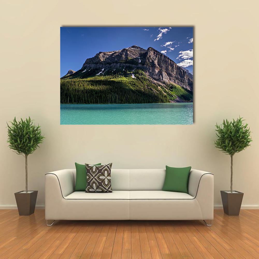 Lake Louise Turquoise Lake and Mountain Peak Canvas Wall Art in gray, green and blue, single panel hung on a wall