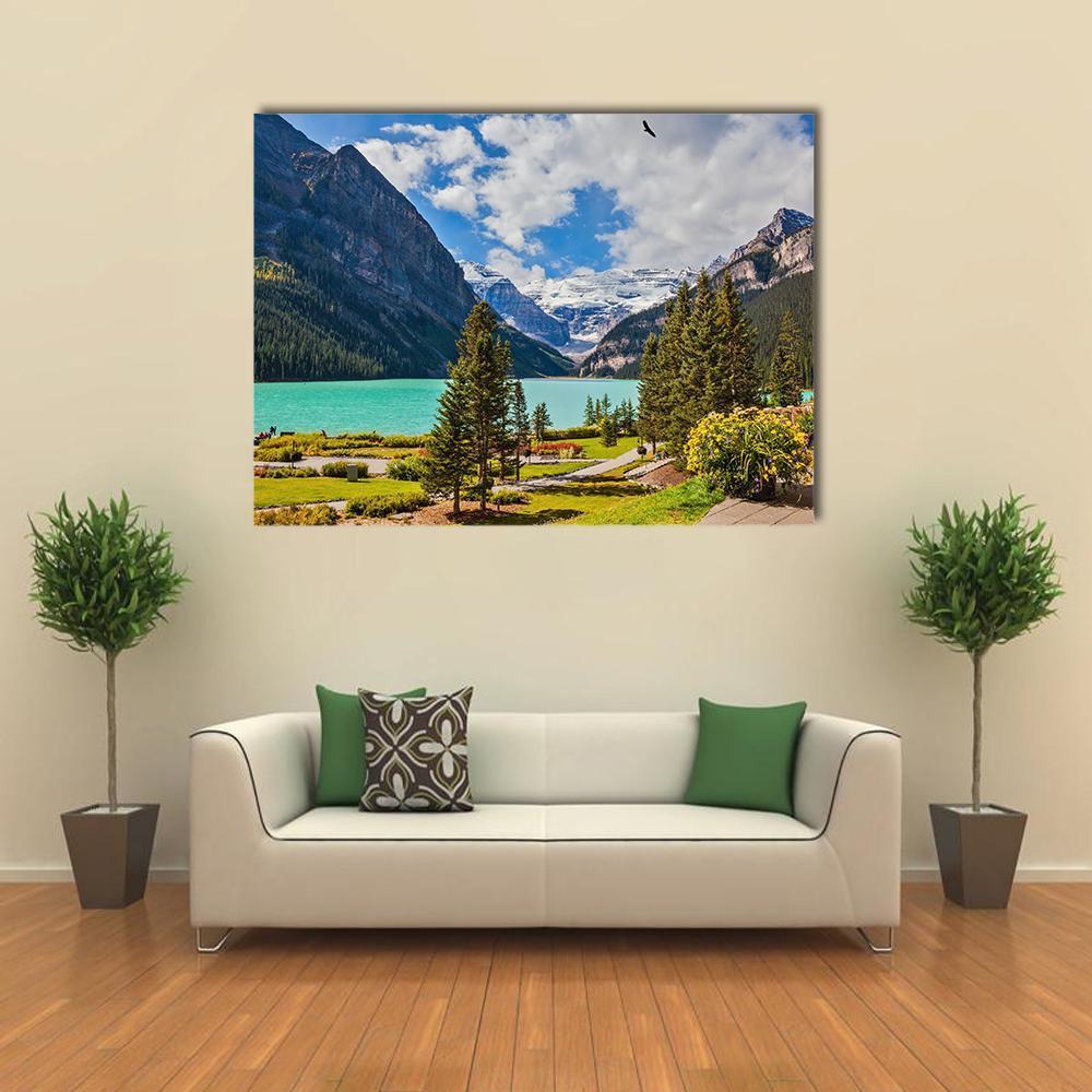 Turquoise Glacial Lake and Mountains Canvas Wall Art in gray, green and blue, single panel hung on a wall