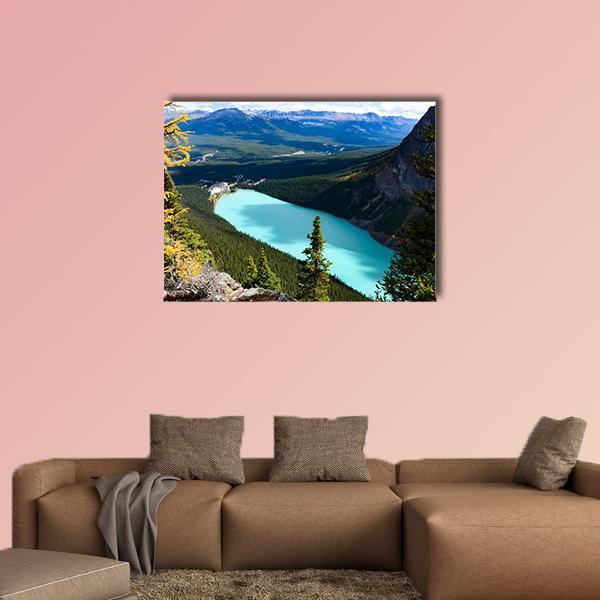 Overlook of Lake Louise Canvas Wall Art in brown, green and blue, single panel hung on a wall