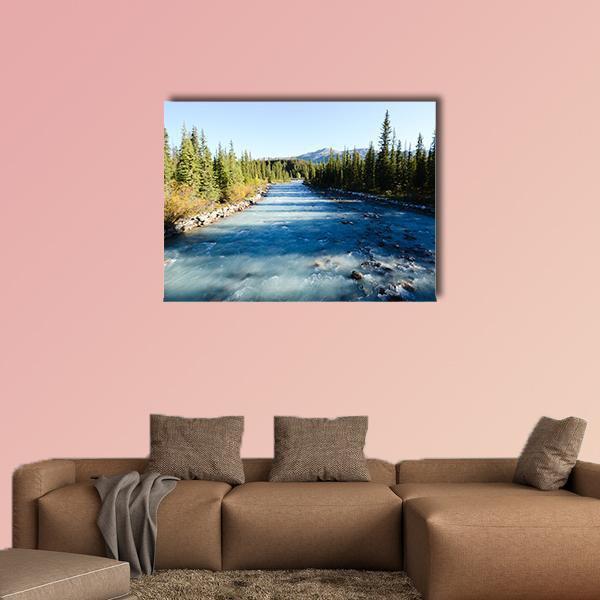Lake Louise Village Canvas Wall Art in white, green and blue, single panel hung on a wall