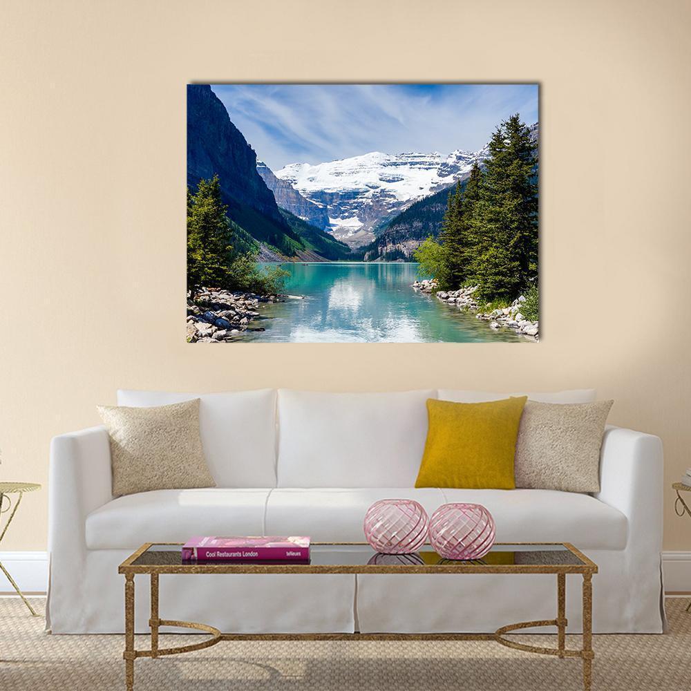 Lake Louise with Snow-capped Mountains Canvas Wall Art in white, green and blue, single panel hung on a wall