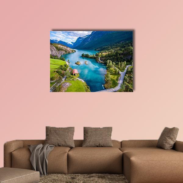 Lake Lovatnet with Red Cabin Canvas Wall Art in green and blue, single panel hung on a wall