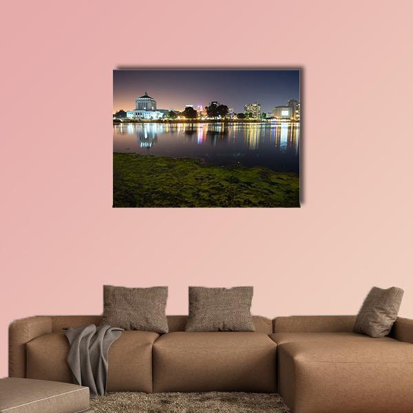 Merritt Lake Nighttime Skyline Reflection Canvas Wall Art in black, green and blue, single panel hung on a wall