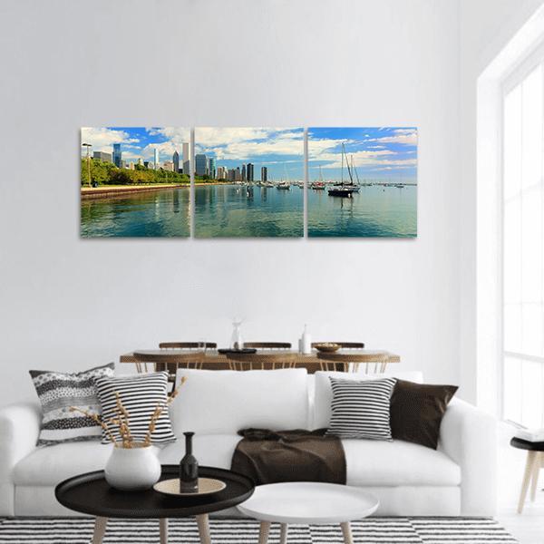 Chicago Skyline Over Lake Michigan Panoramic Canvas Wall Art in white and blue, hung on a wall